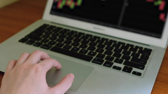 A Person analyzing candlestick chart patterns of Solana  