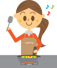 キッチンのガスコンロで料理するエプロン姿の女性・フライパン・母親・笑顔