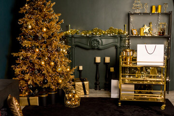 Golden Christmas tree in a festive interior.