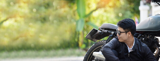 Banner Asian man motorbike in black leather jacket travel rider trip. Panorama Handsome Men wear...