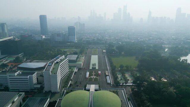 Indonesia Parliament building with misty cityscape