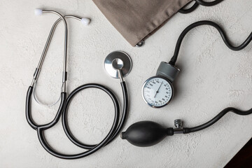 Gray tonometer on a white background. Medical equipment blood pressure monitor. Healthcare. Place...