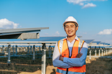 Asian Young engineer standing at solar farm