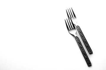 Vintage engraving silverware fork set of two placed side by side isolated on white background
