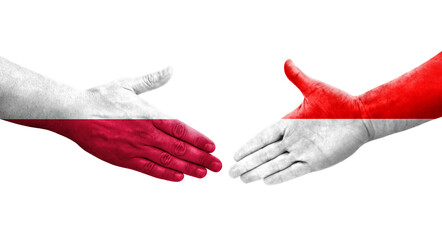 Handshake between Indonesia and Poland flags painted on hands, isolated transparent image.