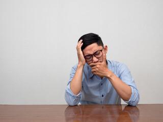 Fototapeta premium Sadness businessman sit alone crying and disheartened