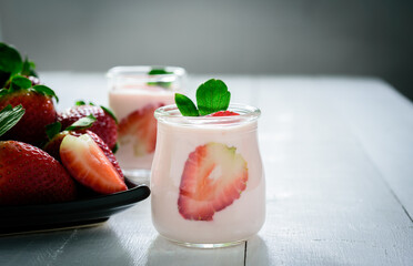 Healthy food of yogurt, Strawberry Yogurt,yogurt with fresh strawberry, wood background