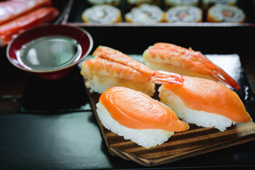 Sushi Set nigiri shrimp and salmon on wood,top view, close up