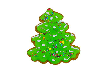 Christmas gingerbread cookie made in shape of Christmas tree isolated on white background