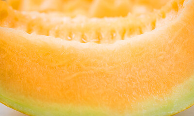 Naklejka na ściany i meble sliced of melons background close up , fresh Melon or cantaloupe, Cantaloupe melons on wood background, Favorite fruit in summer