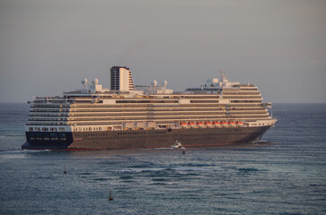 Modern HAL cruiseship or cruise ship liner Koningsdam sail away departure from port during...