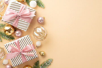 New Year concept. Top view photo of present boxes with ribbon bows transparent white gold and pink baubles and pine branches in frost on isolated pastel beige background with empty space