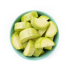 Zucchini cut into slices in a transparent bowl, top view