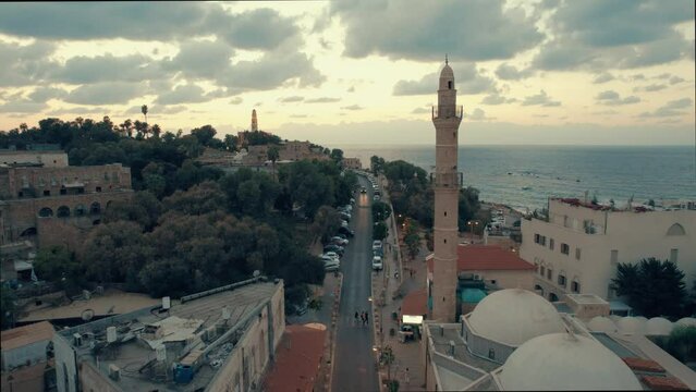 Aerial footage of Tel Aviv-Yafo skyline + jaffa port, St. Nicholas Armenian Orthodox Church + Mahmoudiya Mosque, Israel - October 14, 2022 - #003