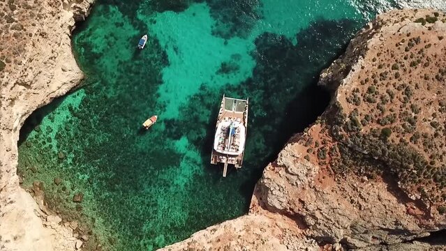 Crystal lagoon with crystal clear water in Malta - SeaBird catamaran