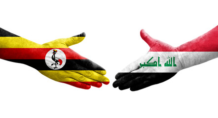 Handshake between Iraq and Uganda flags painted on hands, isolated transparent image.