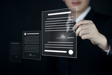 Electronic signature concept and technology and online document management (DMS) for paperless offices. Businessman uses pen to sign electronic documents on virtual screen digital document.