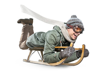Happy adult man riding a sled for fun - obrazy, fototapety, plakaty