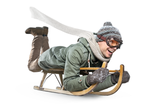 Happy adult man riding a sled for fun