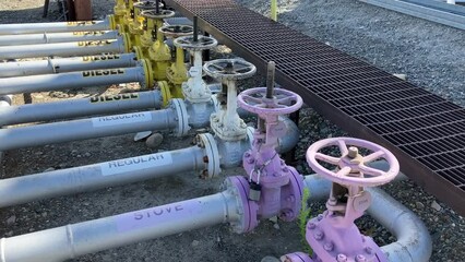 Panning shot showing valves on the various fuel pipes