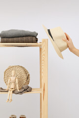Wooden shelving with clothes, concept of autumn season clothes