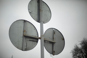 Road sign round. Pillar with round shields. On-road alert.