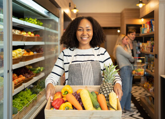 Portrait of a black african american woman working in a supermarket or retail shop and food on grocery products. Food shopping. People lifestyle. Business service. A staff worker
