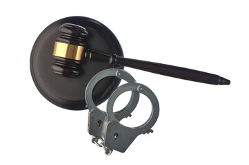 Judge's hammer and handcuffs on white isolated background