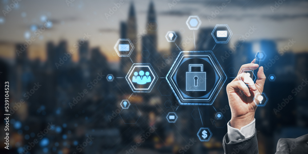 Poster close up of businessman hand using abstract glowing padlock hologram on blurry wide city background.