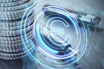 stacked coins and fountain pen on desktop with creative glowing round euro icon and map hologram on blurry background.