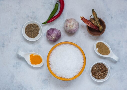Prepared Ingredients for cooking salt with spices, Svan salt on a light concrete background. Recipes for spices, spicy salt.