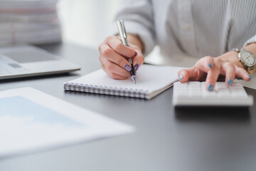 Close up of Business team analyzing income charts and graphs with modern laptop computer. Business analysis and strategy concept.