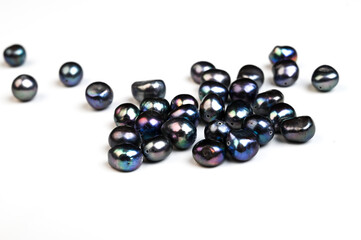 Natural freshwater black round pearl beads isolated on white. Side view