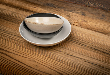 Various Bowl Stack Mockup on Rustic Wooden Texture Background