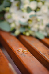 Two wedding rings on the floor with contrast