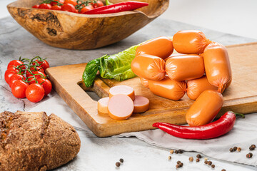 boiled sausages on a bright kitchen table