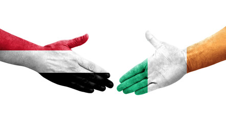 Handshake between Ireland and Yemen flags painted on hands, isolated transparent image.