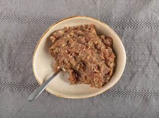 Minced Meat Mix in Round Bowl, Ground Pork, Turkey, Beef and Chicken Meat with Onion and Black Pepper