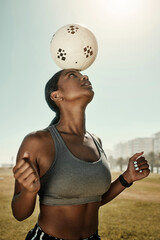 Woman, soccer ball and balance on head in training grass field, sports ground or fitness training...