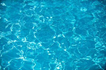 Water in swimming pool, background with high resolution. Wave abstract or rippled water texture.