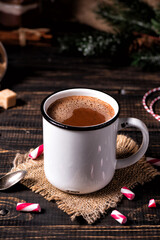 Cup of hot chocolate on the dark wooden table