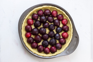 Shortbread dough blank for plum pie. Top view