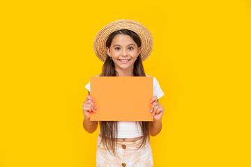 smiling teen girl with copy space on orange paper on yellow background