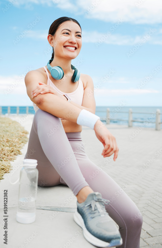 Poster Fitness woman, happy and beach exercise while taking break or rest while out running on promenade with a positive mindset, motivation and goal. Happy asian athlete girl runner outdoor for a workout