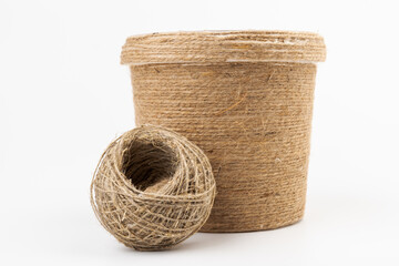 Obraz premium close-up of brown jute twine for DIY and gift wrapping, isolated on white background, concept of zero waste or sustainable lifestyle.
