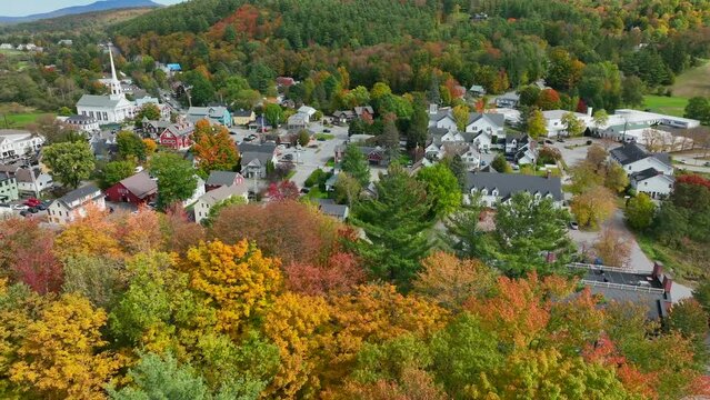 Stowe Vermont in New England, USA. Famous tourist ski town. Beautiful autumn fall foliage. Aerial view.