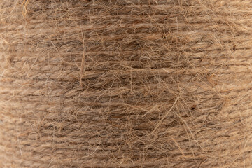 close-up of brown jute twine for DIY and gift wrapping, isolated on white background, concept of zero waste or sustainable lifestyle.