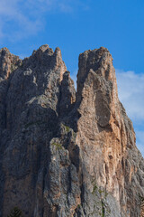 The landscape and the peaks of the Dolomites of the Val di Fassa, one of the most famous and touristic valleys of Trentino, near the town of Canazei, Italy - August 2022.