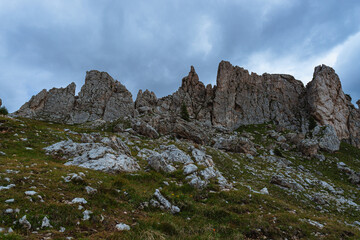 Fototapeta na wymiar The landscape and the peaks of the Dolomites of the Val di Fassa, one of the most famous and touristic valleys of Trentino, near the town of Canazei, Italy - August 2022.