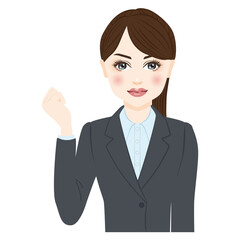 woman in gray suit with ponytale pump a fist in the air